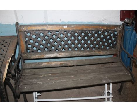 A WOODEN GARDEN BENCH