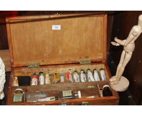 A VINTAGE ARTISTS EASEL, together with a collection of oils in wooden cases and a mannequin