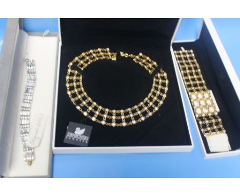 A BOXED CHRISTIAN DIOR 'THE ATTWOOD COLLECTION' BRACELET TOGETHER WITH A SWAROVSKI NECKLACE AND MATCHING BRACELET