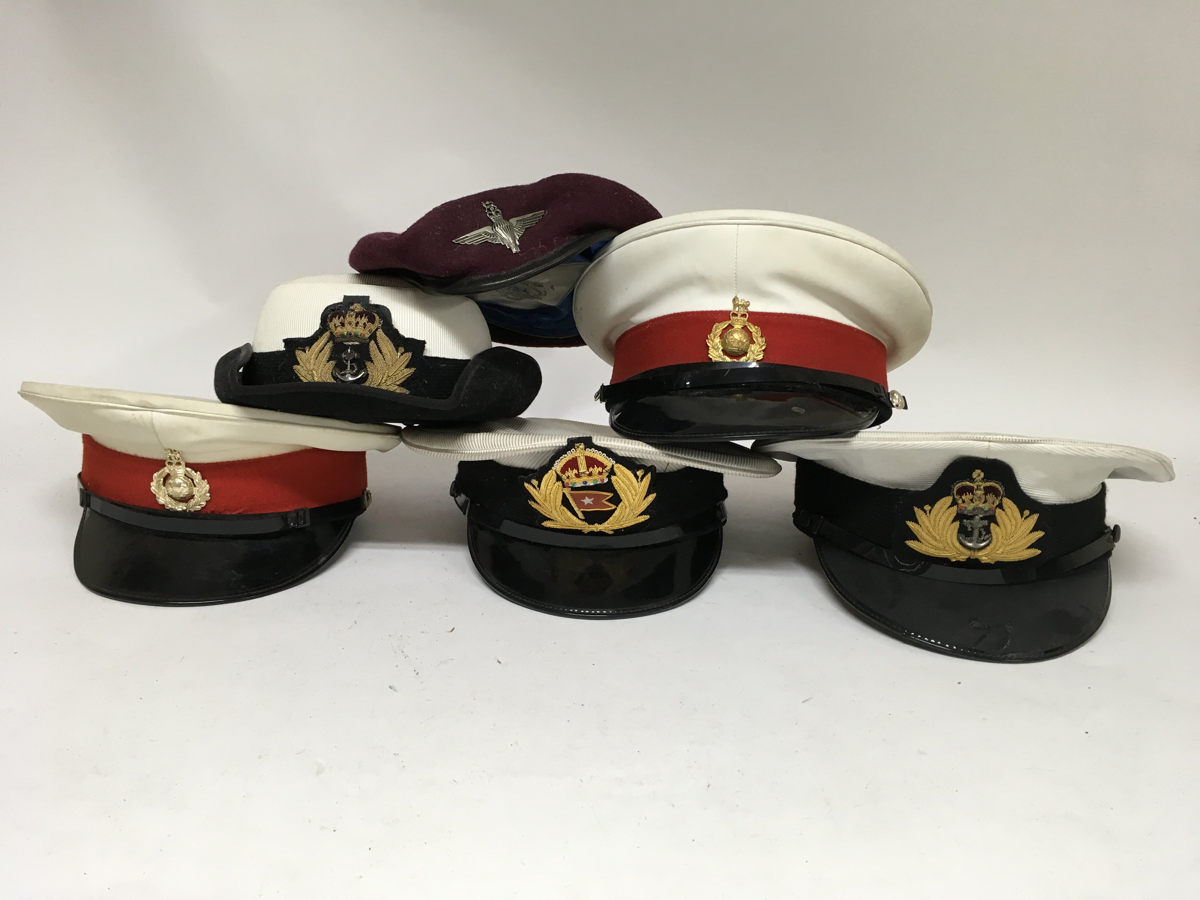 A Group Of Six British Military Style Hats Including Four Peaked Caps   Original 