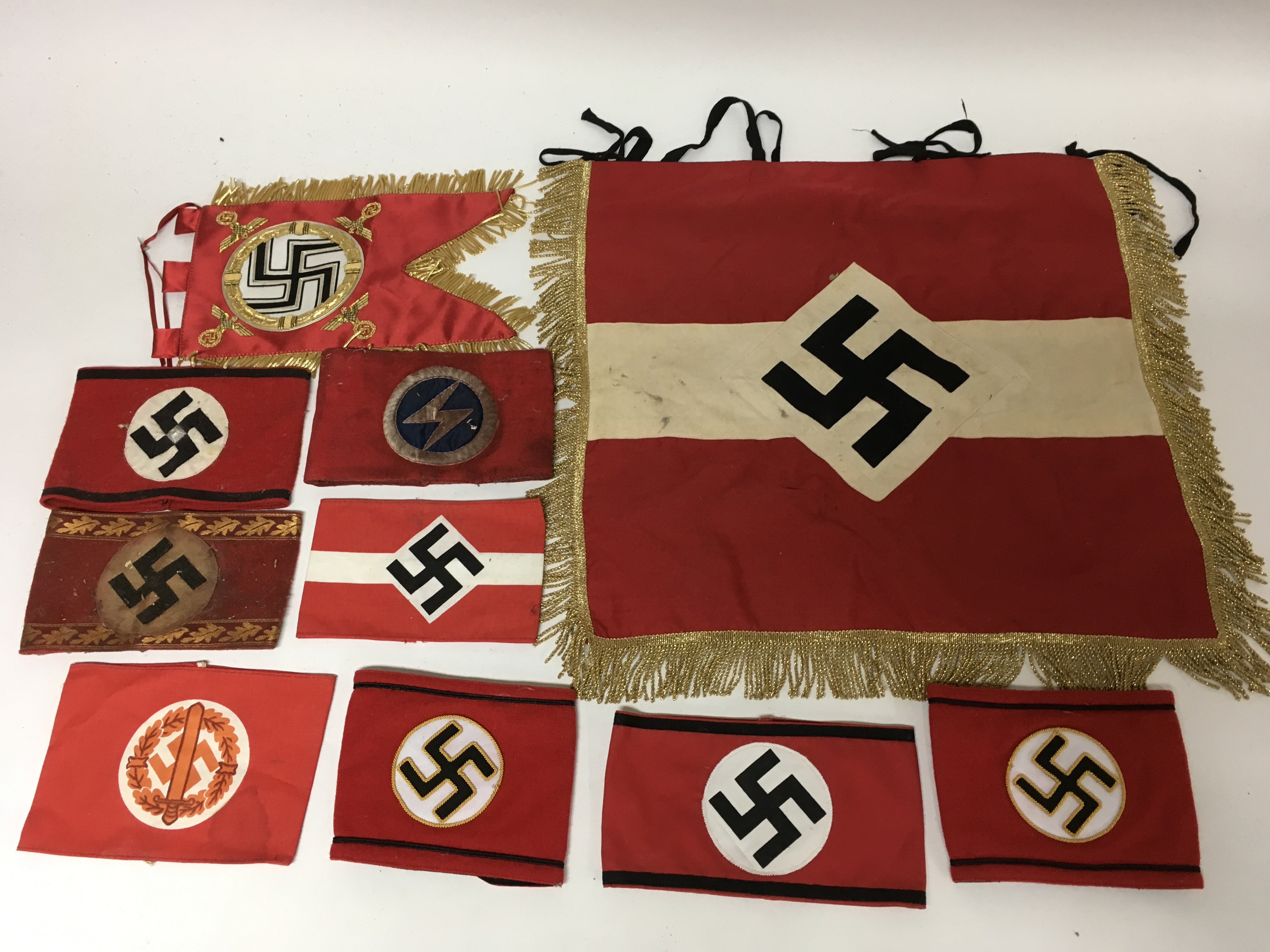 Another group of German WW2 design armbands including a banner and others.