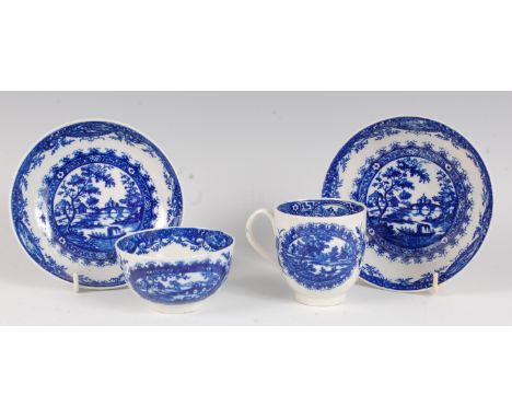 A Worcester porcelain blue and white printed tea bowl and saucer, in the circled landscape pattern, with pseudo Chinese mark 