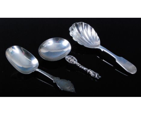 A Victorian silver caddy spoon, having a plain bowl and engraved stem, the terminal with vacant cartouche within a C-scroll b
