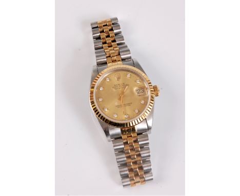 A unisex Rolex Oyster Perpetual Datejust Superlative Chronometer, the signed round champagne coloured dial, with diamond hour