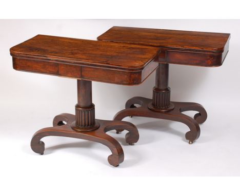 A pair of circa 1830 Scottish rosewood pedestal card tables, the D-shaped fold-over tops with swivel action, opening to revea