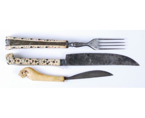 An 18th century North European ivory handled and steel knife and fork, the handles with brass and hardstone inlays, knife len