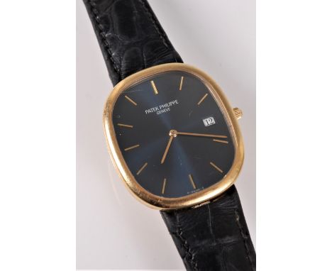 A gentleman's 18ct gold Patek Philippe Ellipse *quartz* wristwatch, the signed rectangular dark blue dial, with baton numeral