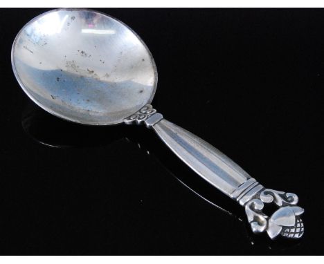 A Georg Jensen silver caddy spoon, in the acorn pattern, stamped verso Georg Jensen Sterling Denmark, circa 1920, 10.2cm.