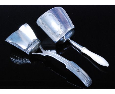 A George III silver caddy spoon, having a shovel shaped bowl with striated decoration and shaped handle, maker unidentified, 