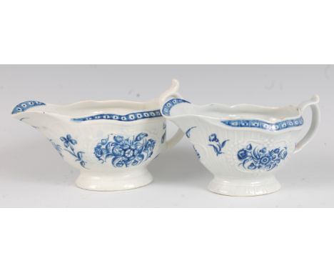 A Worcester porcelain strap fluted sauceboat, underglaze blue printed with flowers, 16.5cm; and one other near-matching examp