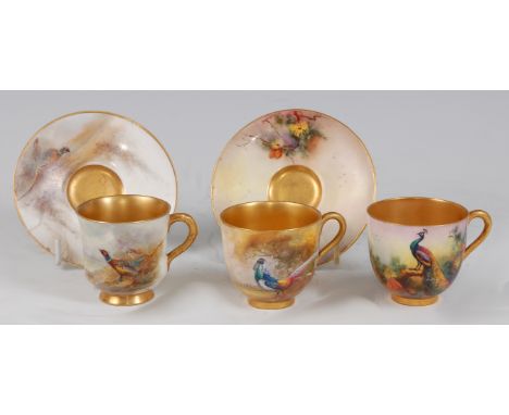 A Royal Worcester porcelain coffee can and saucer, hand-painted with a cock and hen pheasant amidst landscape, signed Jas. St