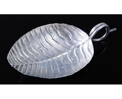 A George III silver caddy spoon, the bowl in the form of a leaf with tendril handle, maker probably Joseph Taylor, Birmingham