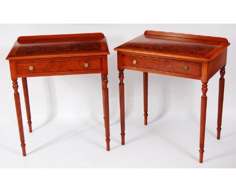 A pair of figured walnut single drawer side tables, in the mid-18th century style, each having feather and crossbanded tops a