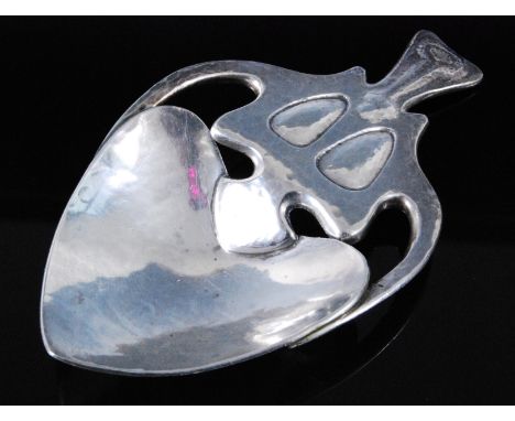 Archibald Knox (1864-1933) for Liberty & Co, An Art Nouveau hammered silver caddy spoon, having a heart shaped bowl with sinu
