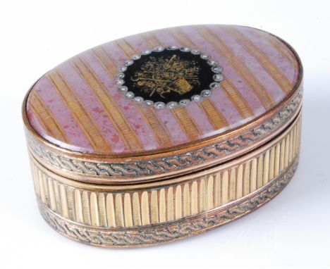 A late 18th century gilt metal and enamel snuff-box, of oval form, the hinged cover hand-painted with a central basket of flo