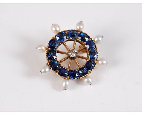 A sapphire, diamond and 'pearl' Captains wheel brooch, the central old cut diamond, estimated approx. 0.10cts, with an outer 