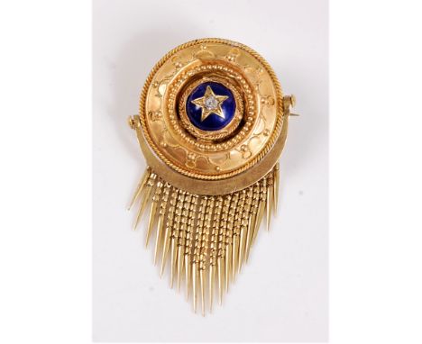 A Victorian Etruscan revival fringe brooch, the round brooch set to centre with a single old mine cut diamond, estimated appr