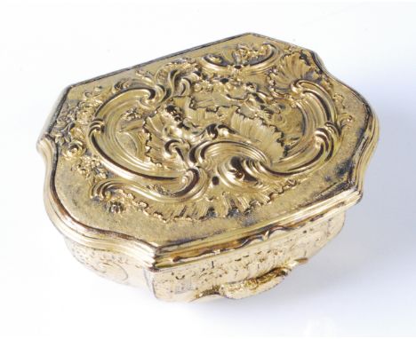 A mid-18th century Rococo gilt metal snuff-box, the whole chased with C-scrolls, shells, scroll flowers and foliage, 6.8cm. S