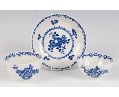 A Worcester porcelain tea bowl and saucer, blue and white printed in the Fruit & Wreath pattern; together with a single tea b