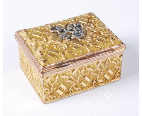 A George III gilt metal snuff-box, of rectangular form, having chased decoration, the hinged cover with central white metal l