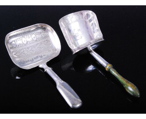 A George III silver caddy spoon, having a shovel shaped bowl engraved with acorns and a turned wooden handle, maker Thropp & 