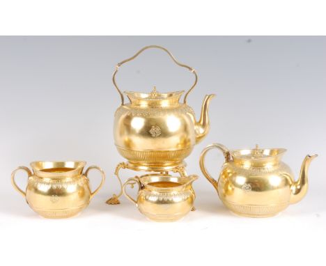 A mid-Victorian silver gilt four-piece tea set, comprising spirit kettle on stand (lacking burner), teapot, twin handled suga