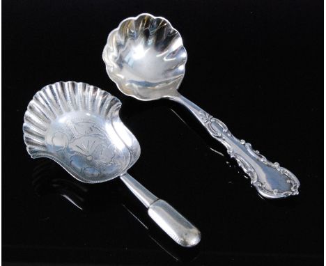 A late Victorian silver caddy spoon, having a fluted bowl and scroll decorated stem, maker George Nathan &amp; Ridley Hayes, 