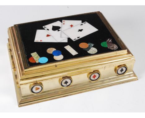 An Italian pietra-dura and lacquered brass games box, late 20th century, the cover decorated with playing cards and counters,