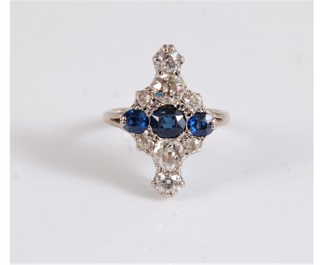 An early 20th century 18ct sapphire and diamond ring, the three graduated oval sapphires, set above and below with two gradua