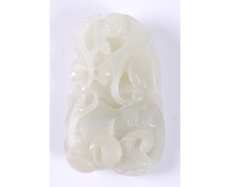 A Chinese celadon jade carving of a boy with elephant amidst scrollwork, 9cm. Drilled small hole for pendant loop to back.Oth