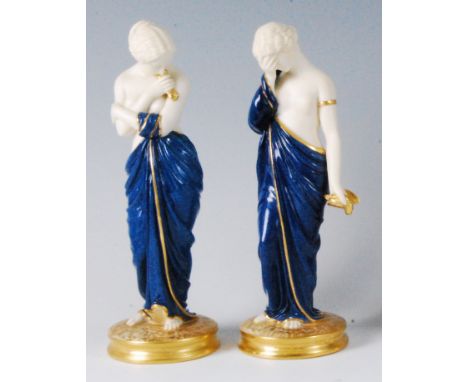 A pair of Royal Worcester porcelain figurines depicting Joy and Sorrow, modelled by James Hadley, the robed maidens each with