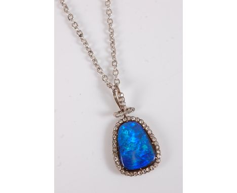 A black opal and diamond pendant, the rounded pear shape black opal, approx. 21 x 15.3 x 5.2mm, surrounded by old cut diamond