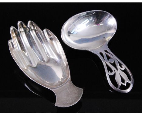 A George VI silver caddy spoon in the form of a right hand, maker Francis Howard Ltd, Sheffield, 1942, 7.2cm, together with o