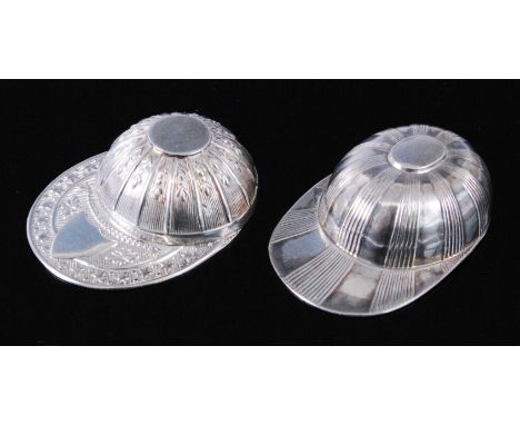 A novelty silver caddy spoon in the form of a jockeys cap, having a vacant sheild shaped cartouche to the peak, maker Horton 