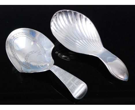 A George III silver caddy spoon, having an oval shell shaped bowl, the terminal with oval vacant cartouche, maker Thomas Lamb
