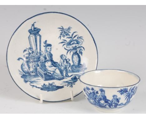 A Worcester porcelain tea bowl and saucer, blue and white printed in the Mother & Child pattern, crescent C marks verso, circ