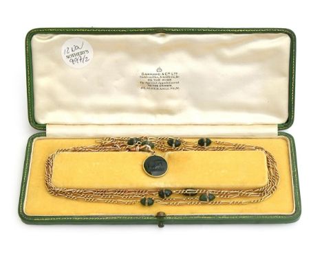 9ct gold and jade long necklace with small pendant depicting a Kiwi bird in a green Garrard &amp; Co. box 