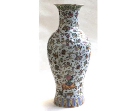 A large 20th century Chinese famille rose baluster vase, profusely decorated in enamel with images of fans and flora, the rim