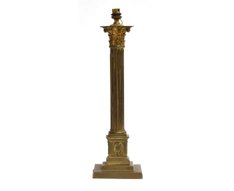 A gilt metal table lamp in the form of a reeded corinthian column, on square plinth base, 48cm high 