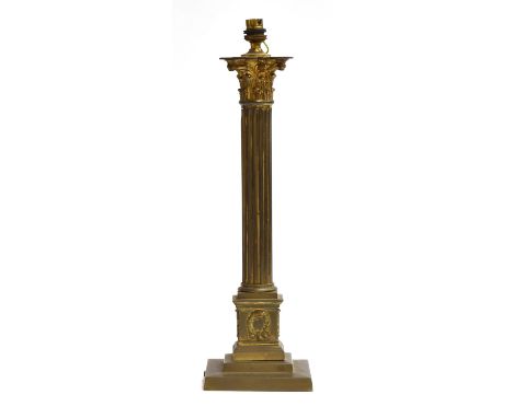 A gilt metal table lamp in the form of a reeded corinthian column, on square plinth base, 48cm high 