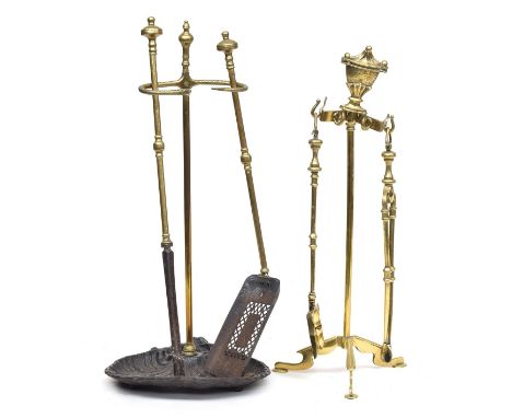 Two part sets of fire tools, each on stands, on with cast iron shell design 