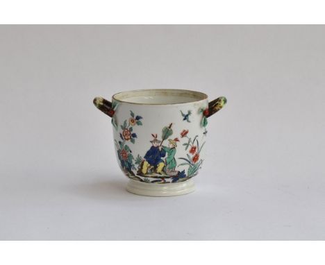 An 18th century porcelain twin handled cache pot, bearing red trumpet fanfare Chantilly mark to base, painted with Oriental s