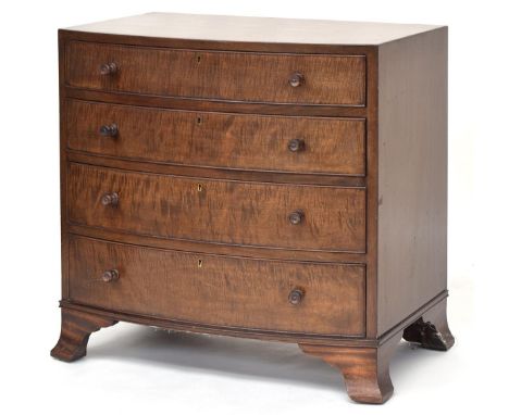 A small 20th century Heal's bow front mahogany chest of four graduating cockbeaded drawers, on swept bracket feet, bearing iv