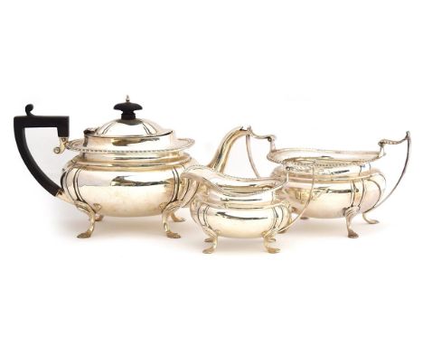 A silver three piece teaset, by James Deakin &amp; Sons, Sheffield 1908 and 1909, of rectangular form with gadrooned edge on 