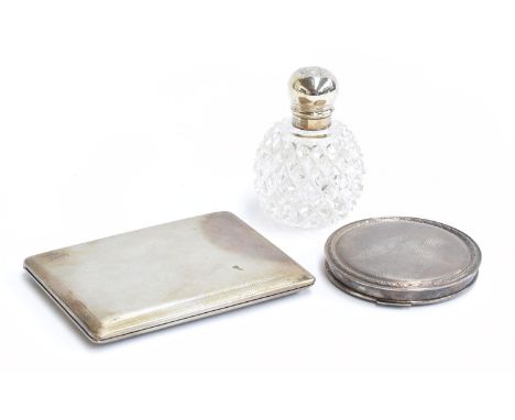 An engine turned silver and silver gilt cigarette case, together with a silver compact, by Garrard &amp; Co. Ltd, Birmingham 