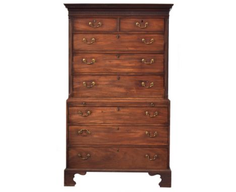 An early 19th century mahogany chest on chest, dentil cornice above two short over three long drawers flanked by stop-fluted 