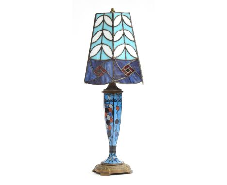 An Art Deco Tiffany style table lamp and shade, the brass base with hand painted enamel stem decorated with grapes, signed, 4