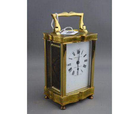 Vintage brass cased carriage clock, the dial marked 'W Greenwood & Sons, Leeds & Huddersfield' (crack to one glass side panel
