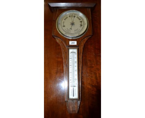 An Art Deco oak barometer