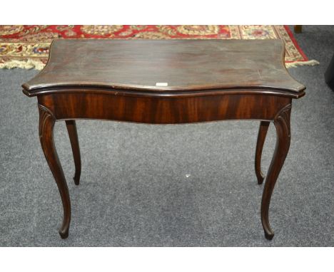 A George III French Heppelwhite serpentine card table, folding top enclosing an inset baize lined playing surface, carved sle